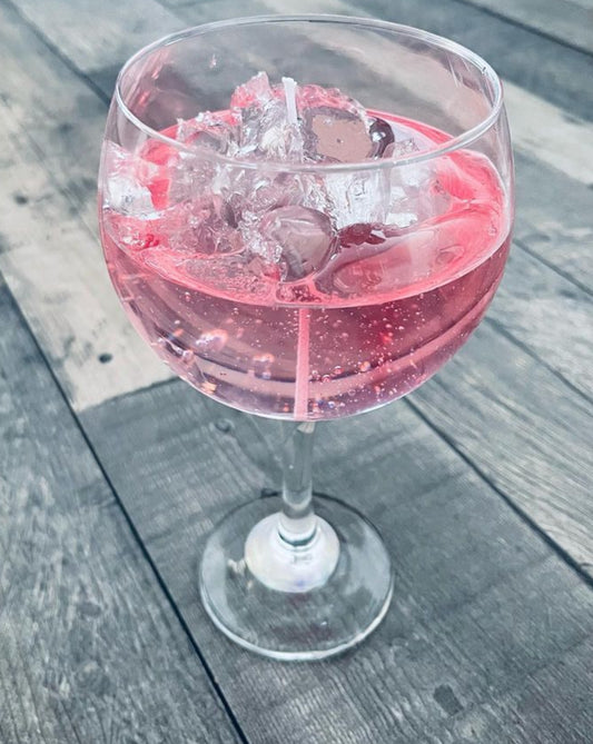 Pink gin with ice candle