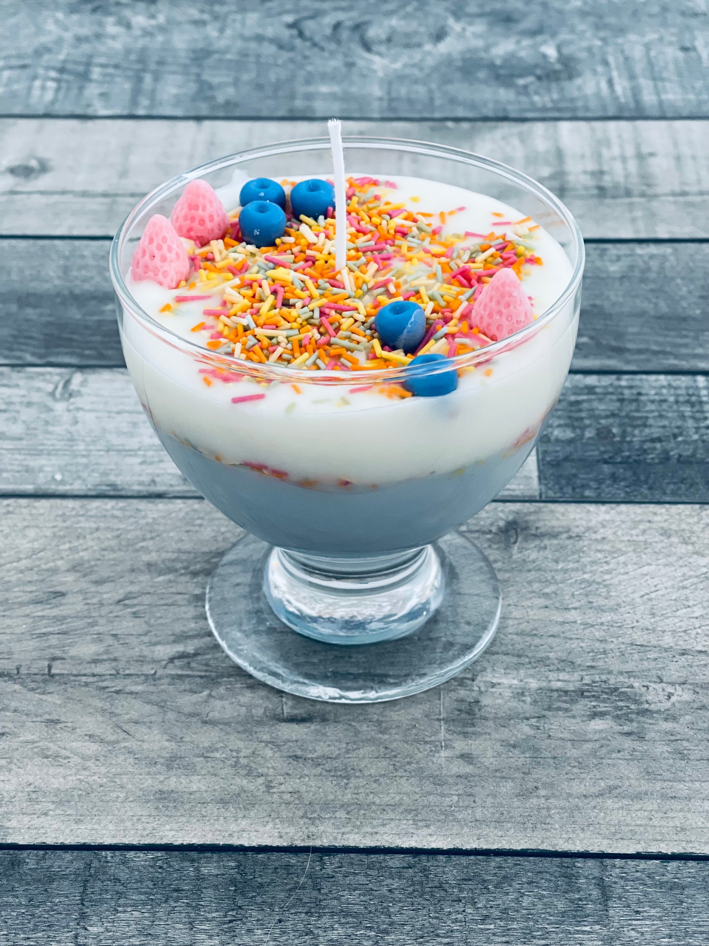 Ice cream with sprinkles and fruit candle